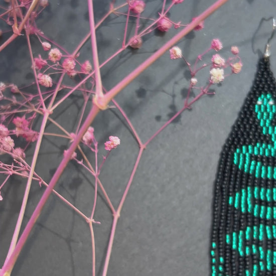 Handmade long beaded earrings with green snake design in boho style. Unique statement jewelry with fringe, perfect gift and standout accessory for any look video 1