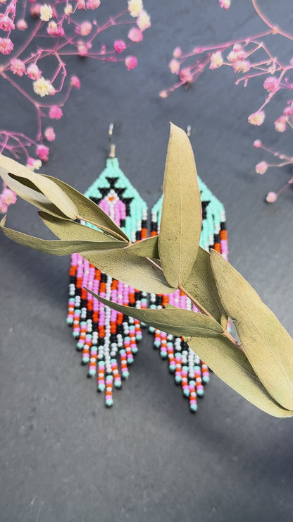 Handmade long beaded boho earrings in turquoise, black, silver, pink, and orange. Geometric design with elegant fringe, lightweight statement jewelry for any occasion  video 1