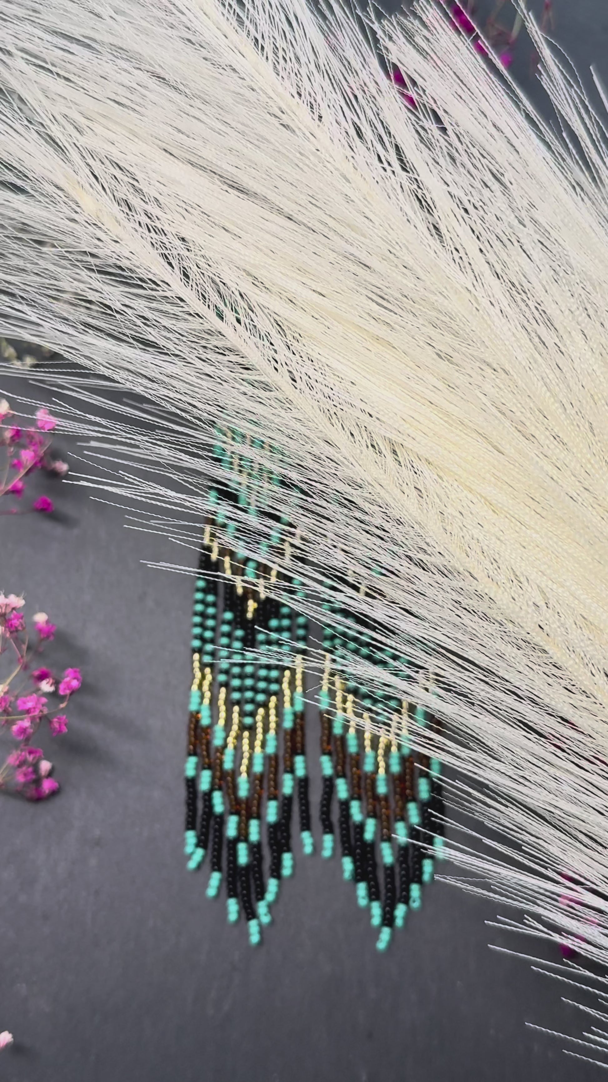 Handmade long black, turquoise, and gold beaded earrings with Native American ethnic design and fringe. Unique boho statement earrings for women video 1