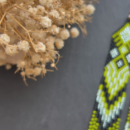 Long black, green, and mint green beaded earrings with Native American ethnic design and fringe. Handmade boho earrings for women, unique earrings for women video 1