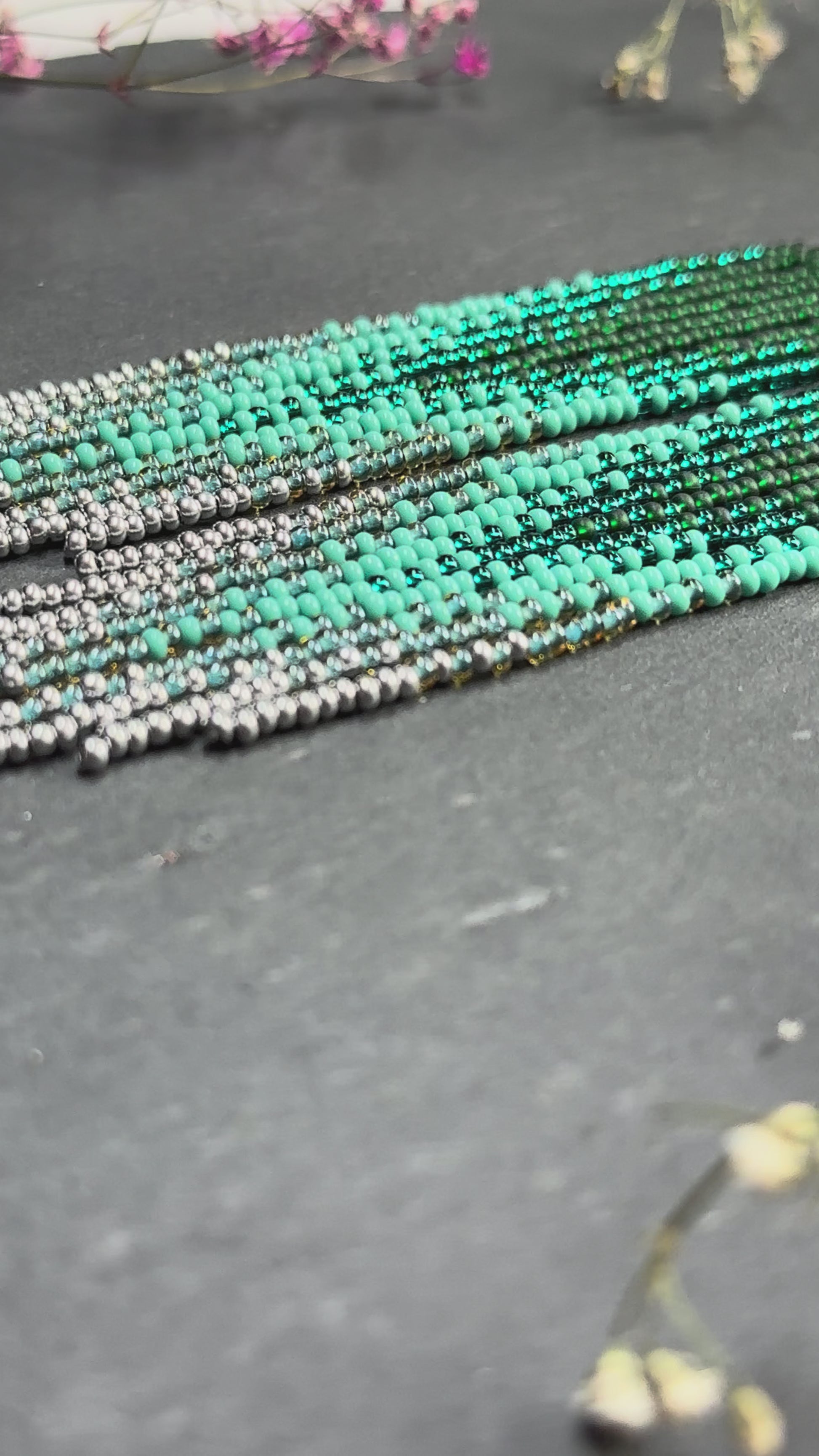 Long green and silver beaded fringe earrings on hoop base with 925 sterling silver hooks. Bright handmade statement earrings with gradient design in boho style video 1