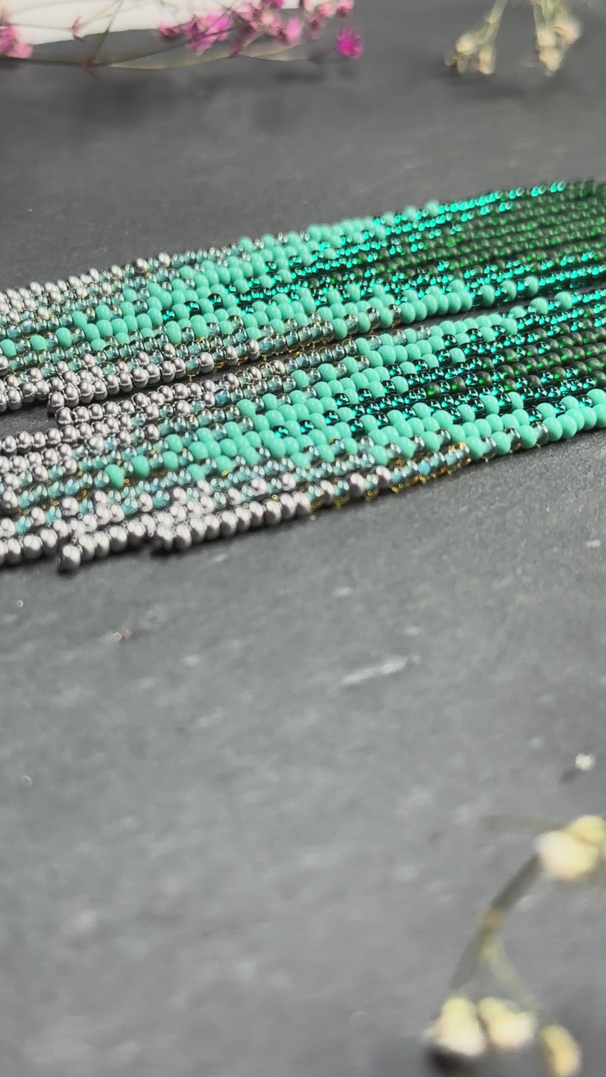 Long green and silver beaded fringe earrings on hoop base with 925 sterling silver hooks. Bright handmade statement earrings with gradient design in boho style video 1