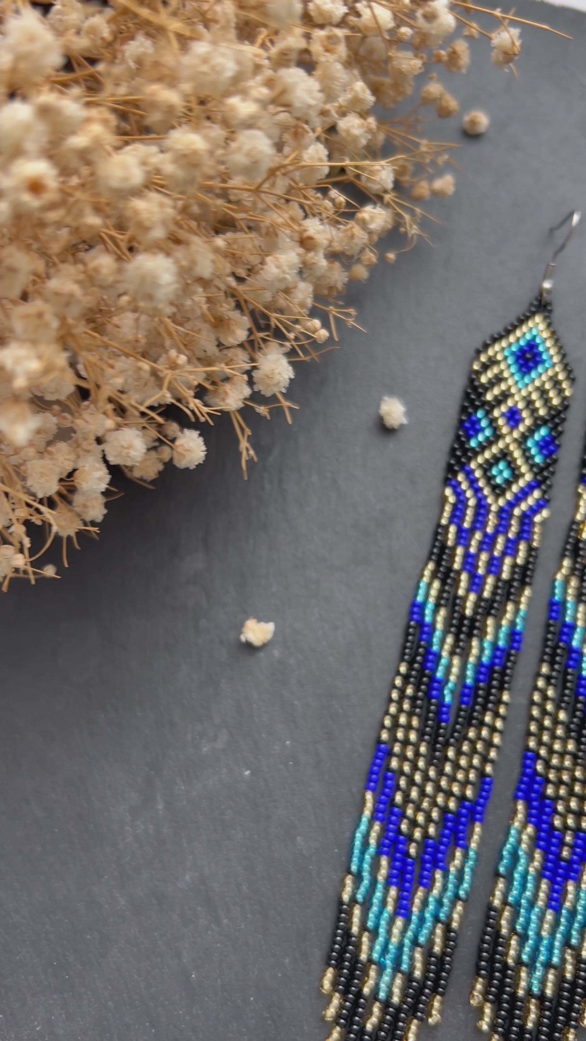 Handmade long black, blue, and gold beaded earrings with Native American ethnic design and fringe. Unique statement boho earrings for women video 1